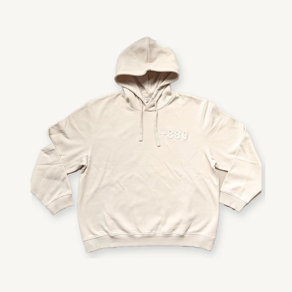 Cream pullover hoodie produced through our manufacturing network